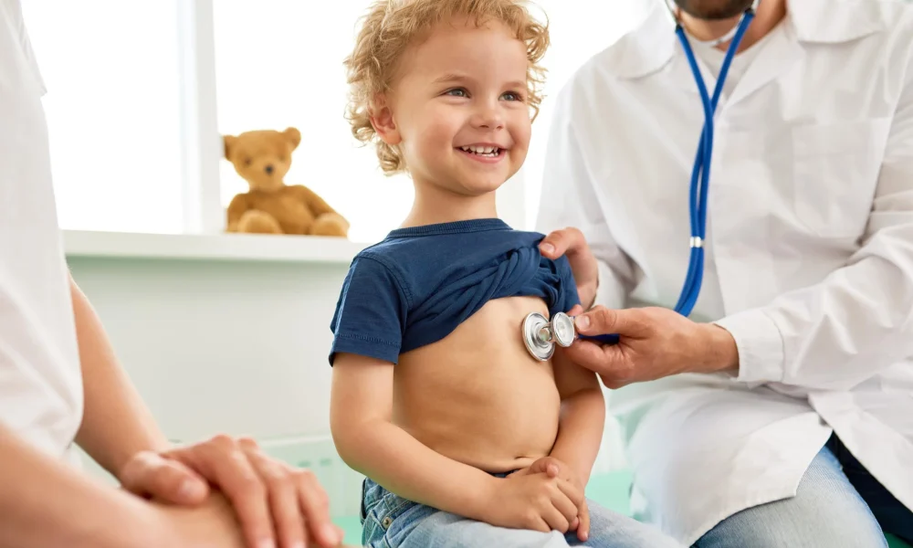 smiling-little-boy-medical-exam-min-scaled